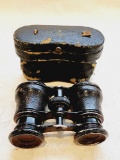 Antique opera glasses in case