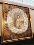 Framed print of a lady w/ mirrored wreath