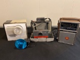 Polaroid 104 camera, Wink light, GE AM/FM radio.