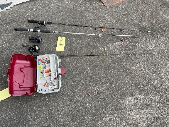 three fishing rods with tackle box