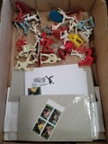 Plastic men baseball players, stamps, and envelopes