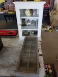 White cabinet with table lighters, small display cabinet