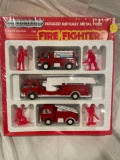 Tootsietoy die cast fire trucks with firefighters