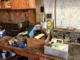 Assorted tools, hardware, index files on top of workbench.