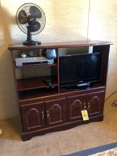 Entertainment center with Samsung TV, small fisher speakers and fan