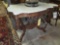 marble top carved wood victorian table with carved dog on base