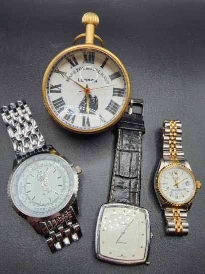 Faux (?) Rolex & Breitling watches and Royal Navy paperweight clock