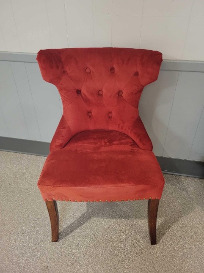 Modern upholstered chair with nail trim
