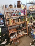 shelf contents includes stoneware pitcher, china, Jim Beam bottle, figurines, and more