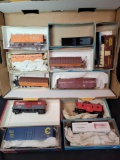 Group of HO box cars, caboose and model kits