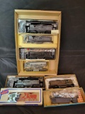 Box of HO dummy and model kit locomotives, 1 customized
