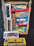 Group of HO box cars, hoppers, exploding Lionel car