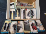 Box of assorted HO model semi kits and parts, not complete