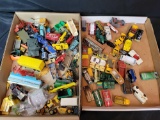 2 boxes of assorted Lesney Matchbox Hotwheels played with toy cars, chassis and parts
