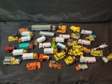 Group of Ertl Hotwheels Matchbox metal and plastic model cars, construction vehicles and semi's