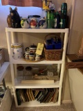 tea set, pig bank, shelf of jars, frames