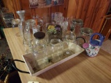 large assortment of glassware - bowls, vases, wine glasses, bottles, decorative items, & urns