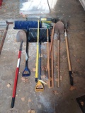 assortment of tools- shovels, snow shovel, rakes, hoes, broom, and more