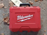 Milwaukee battery powered drill with bits, charger, and case