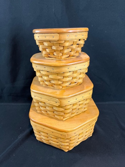 graduated set of Longaberger covered baskets
