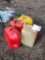 five plastic gas cans