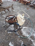 chainsaw, backpack sprayer, and propane burner base