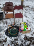 folding chairs, extension cords, trouble light, and box of cleaners