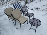 four metal outdoor chairs with side table and cushions/pillow