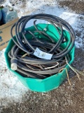 plastic tub of electrical cords and extension cords