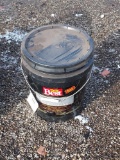 bucket of driveway filler and sealer