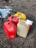 five plastic gas cans
