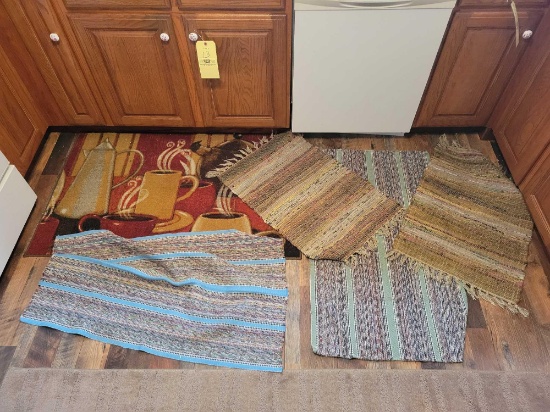 Group of assorted woven rugs and coffee themed rug