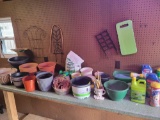 Contents of potting bench, planters and gardening tools