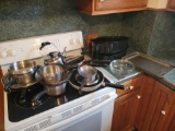 Group of assorted pots and pans, roaster, baking sheets, stemware and utensils