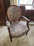 Upholstered chair with wood frame and nail head trim