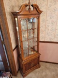 Modern lighted curio with glass shelves, contents not included