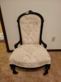 Victorian low seat upholstered chair with casters