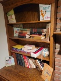 Contents of bookcase, childrens and auto books