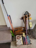 Haynes repair manual, magazine rack, wood shaft putter and canes