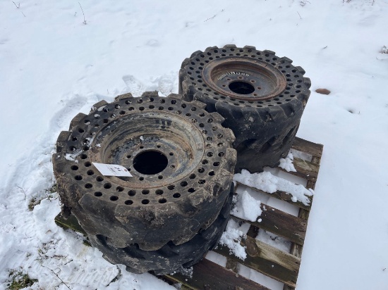 (4) MOUNTED SOLID SKID STEER TIRES 30X10-16