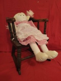 Early hip hugger rocker/potty chair, with modern rag doll