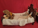 Early Victorian doll bed with china head dolls and stuffed animals