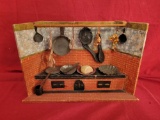 Wood kitchen display with tin metal tools