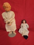 Pair of Antique dolls, porcelain head marked Germany and damaged plastic doll