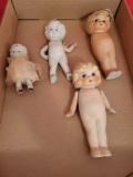 Box of assorted porcelain kewpie dolls