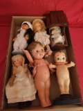 Box of Kewpie and baby dolls, plastic kewpie, baby and cradle