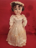 Porcelain head doll marked 1910 6, jointed body
