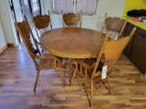 oak table with 5 press back chairs