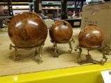 3 wooden globes