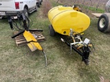 Phil Brown under tree sprayer with Demco 300 gallon tank